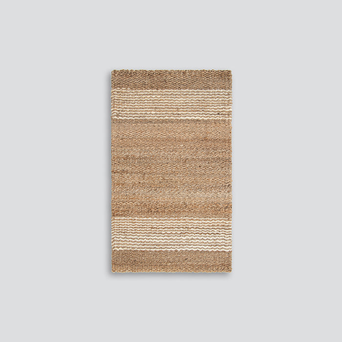 Jute handwoven floor mat in natural colours with a white wavy stripe.  Perfect for front entrance doors.