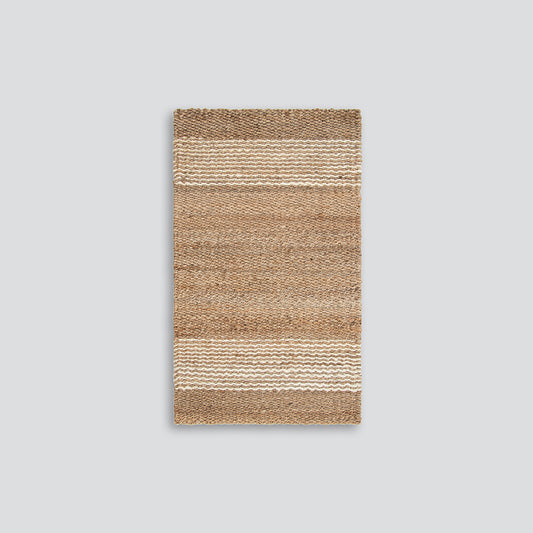 Jute handwoven floor mat in natural colours with a white wavy stripe.  Perfect for front entrance doors.