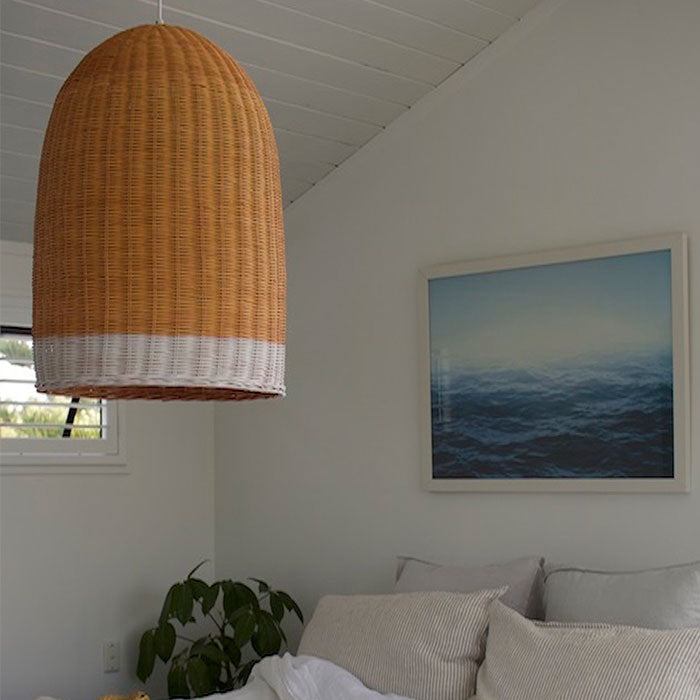 Strong and durable rattan light shade in a natural colour with a white stripe at the bottom